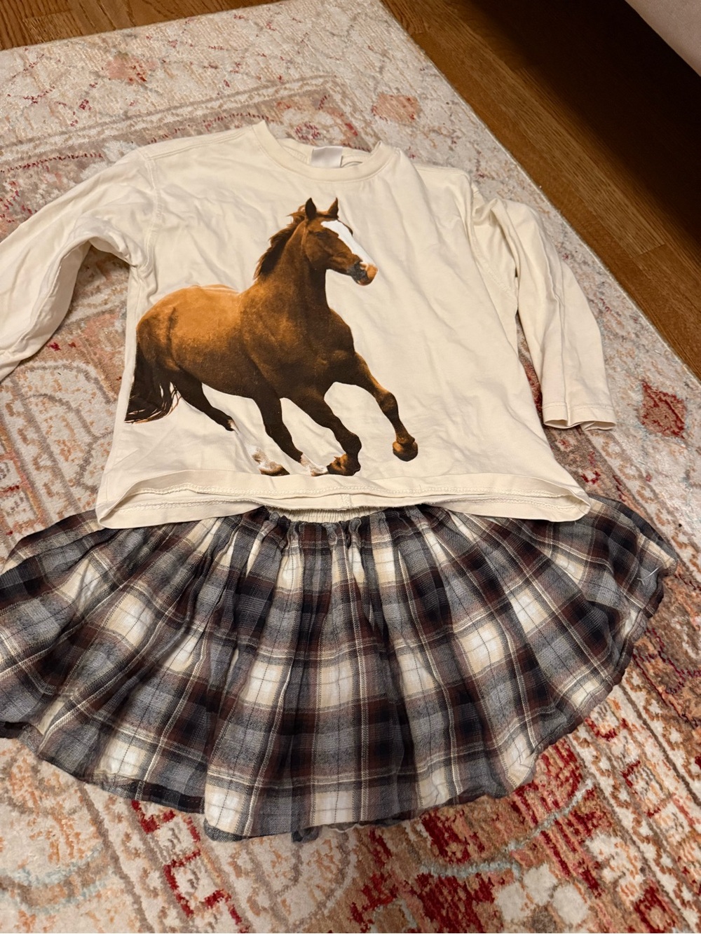 Zara Cream Long-Sleeve Top with Brown Horse Graphic and plaid skirt. Size 6/7